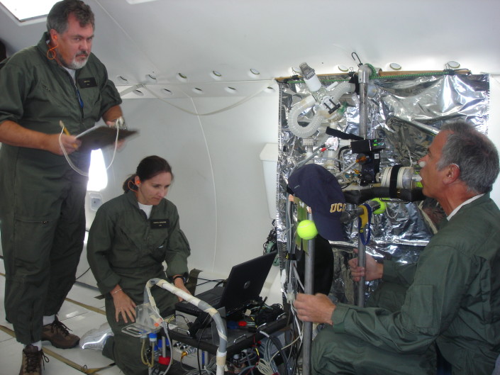 Dr. Kim Prisk (left) and Dr. Chantal Darquenne (center) measure aerosol deposition in Jeff Struthers’ lungs during a lunar gravity portion of a Reduced Gravity Flight for an experiment funded by the National Space Biomedical Research Institute. Prisk’s research team is seeking to determine how moon dust acts in the human lungs and its health risks to astronauts. 
